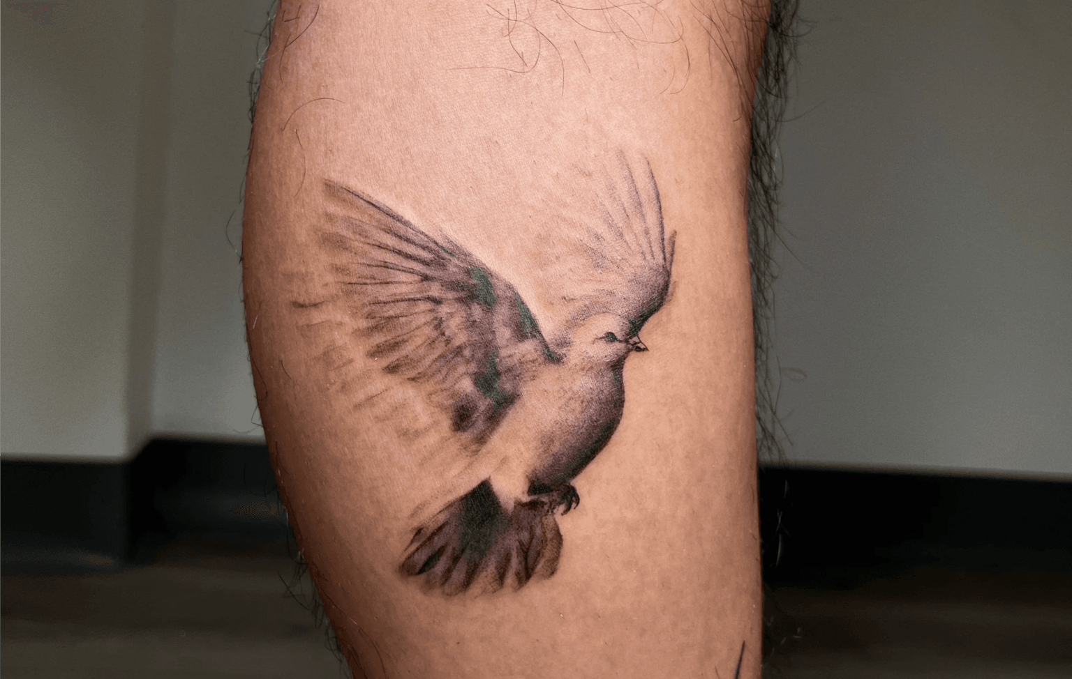 bird flying tattoo meaning
